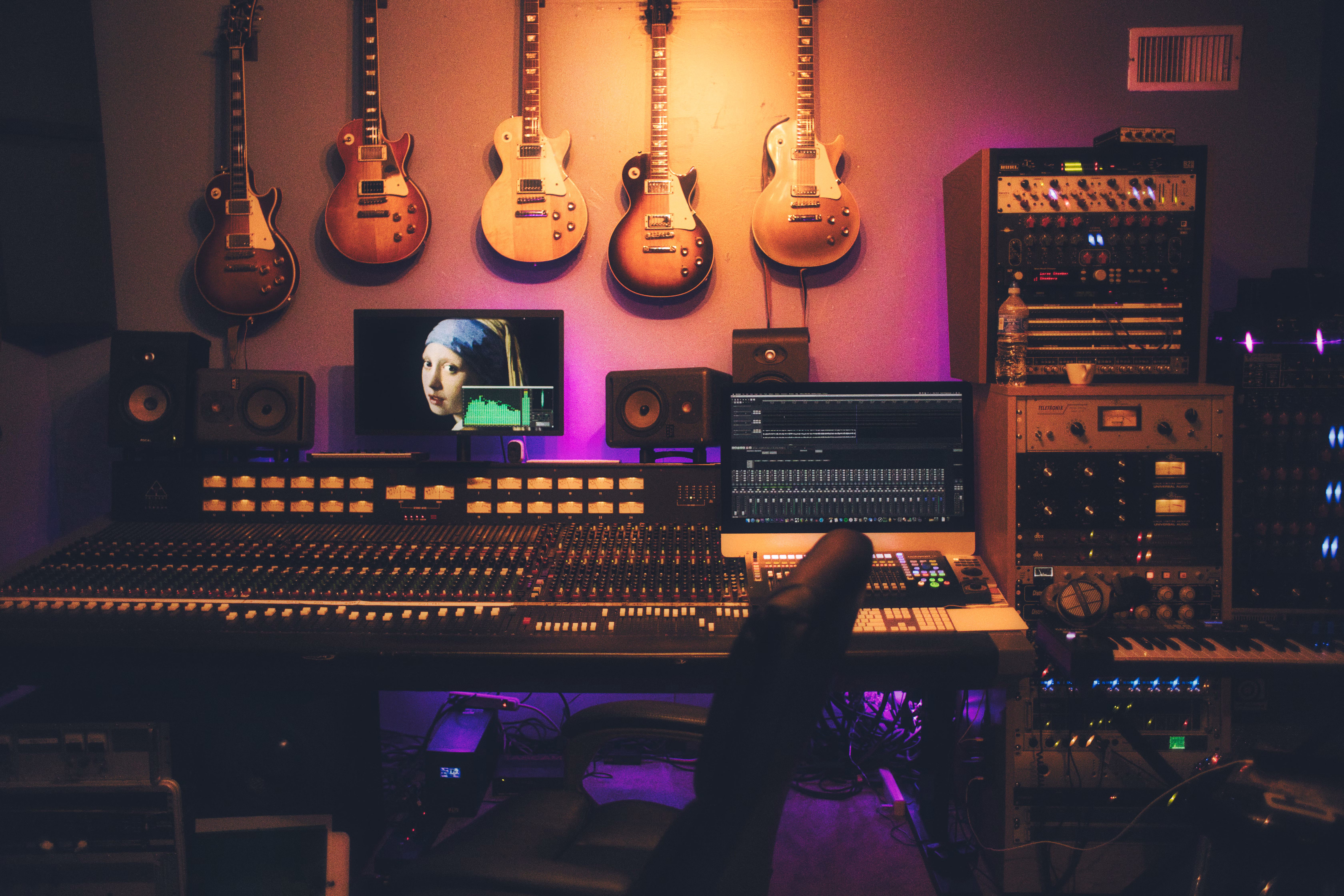 Professional studio production room with microphones and acoustic treatment